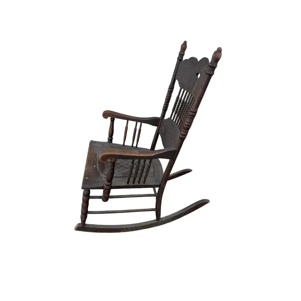 Antique Spindle Rocking Chair With Carvings and Cutout accent